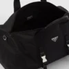 Cestovní taška z materiálu Re-Nylon a kůže Saffiano Cestovní taška z materiálu Re-Nylon a kůže Saffiano