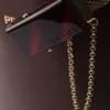 Kožená taška Prada Buckle s ozdobným páskem Kožená taška Prada Buckle s ozdobným páskem