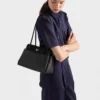 Kožená taška Prada Passage Medium s klopou z materiálu Re-Nylon Kožená taška Prada Passage Medium s klopou z materiálu Re-Nylon