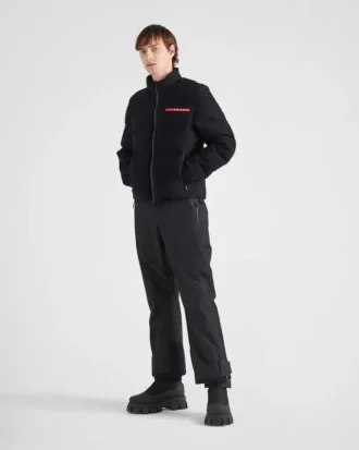 Krátká technická pletená péřová bunda
