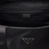 Kufr z materiálu Re-Nylon a kůže Saffiano Kufr z materiálu Re-Nylon a kůže Saffiano