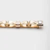 Náramek Eternal Gold Bow ze žlutého zlata a diamantů vypěstovaných v laboratoři Náramek Eternal Gold Bow ze žlutého zlata a diamantů vypěstovaných v laboratoři