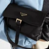 Středně velká kožená taška přes rameno Prada Explore s klopou