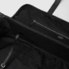Středně velký kufr z materiálu Re-Nylon a kůže Saffiano Středně velký kufr z materiálu Re-Nylon a kůže Saffiano