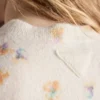 Vlněný svetr s kulatým výstřihem a květinovým potiskem Vlněný svetr s kulatým výstřihem a květinovým potiskem